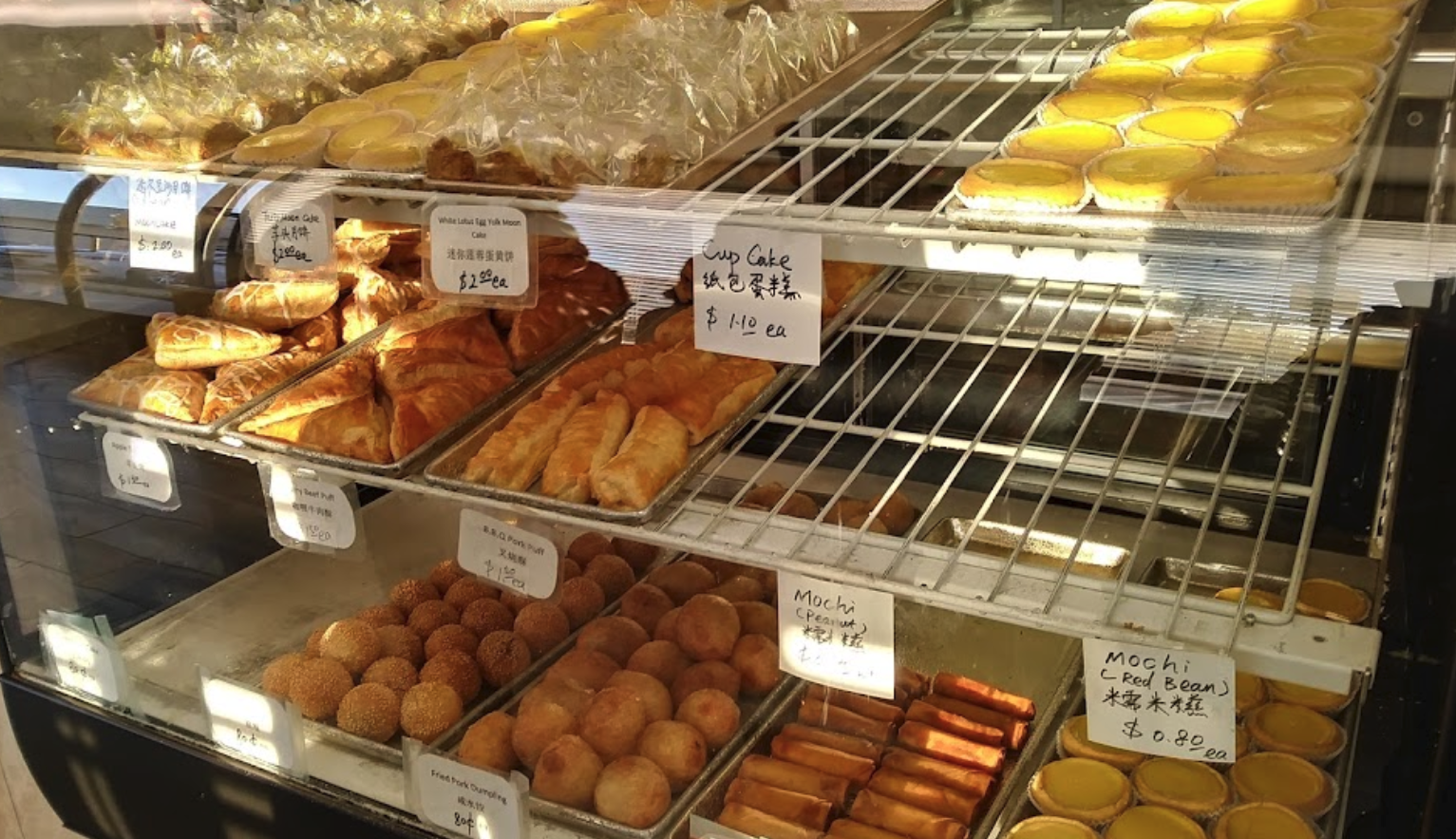 Spread of dim sum items including cheung fun and dumplings